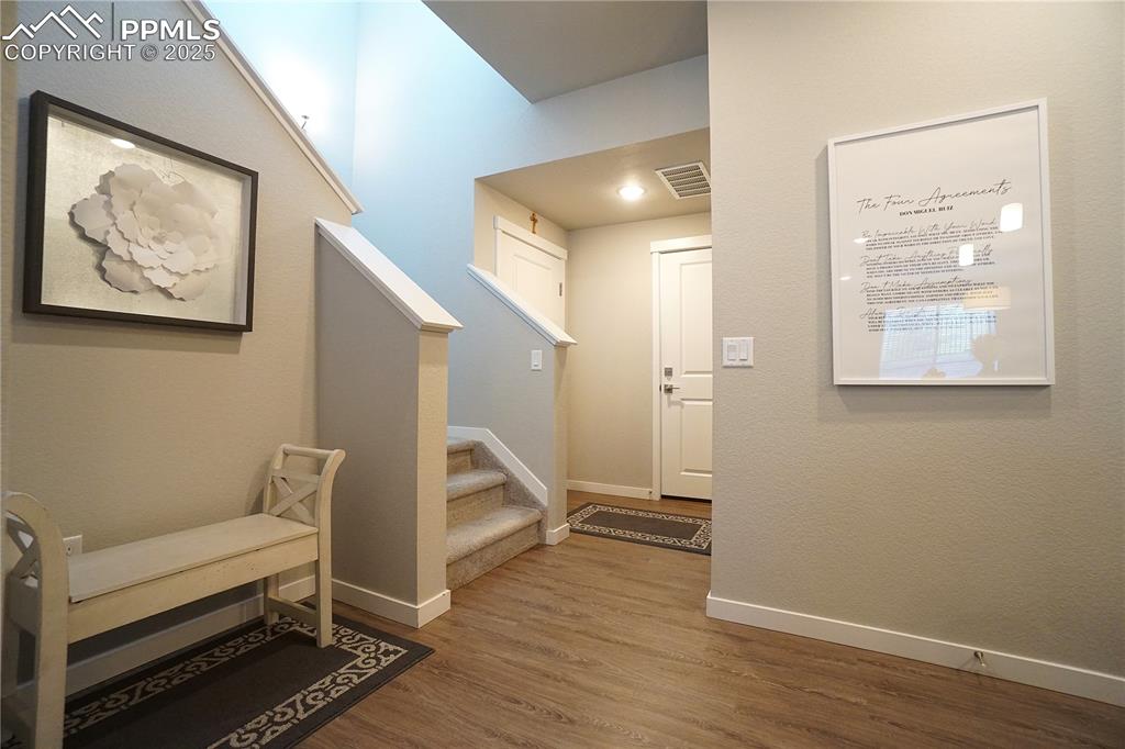 5309 Passport View Colorado Springs, CO 80922 - Photo 14 of 33 a view of livingroom with furniture and wooden floor