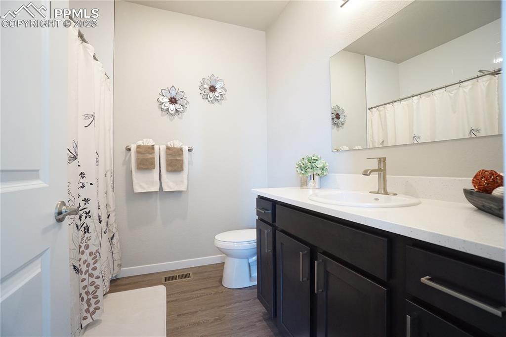 5309 Passport View Colorado Springs, CO 80922 - Photo 16 of 33 a bathroom with a sink and a mirror