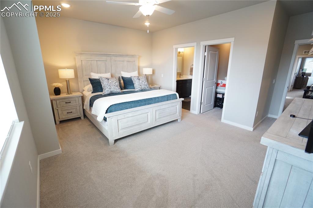 5309 Passport View Colorado Springs, CO 80922 - Photo 24 of 33 a bed room with a bed and a flat tv screen