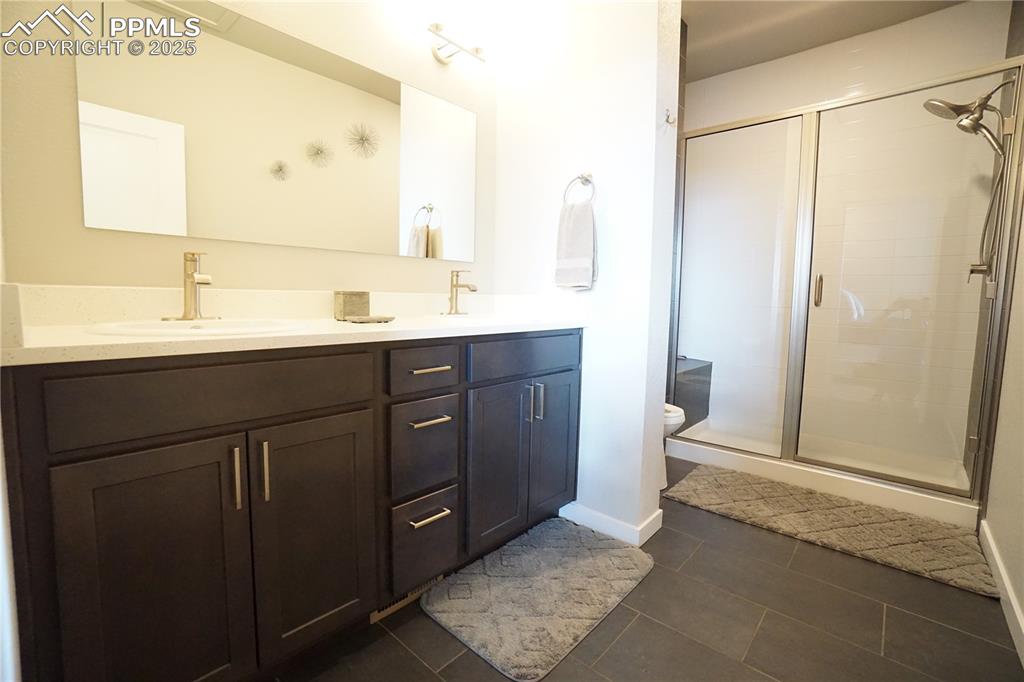 5309 Passport View Colorado Springs, CO 80922 - Photo 29 of 33 a bathroom with a sink and a mirror