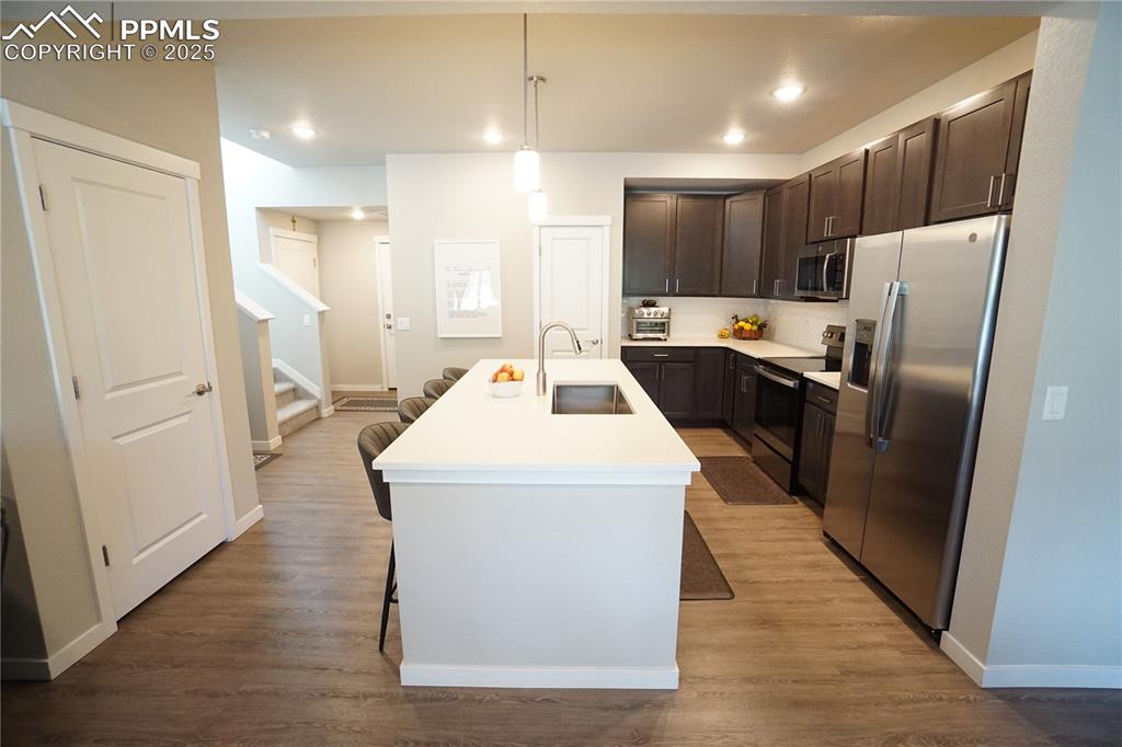 5309 Passport View Colorado Springs, CO 80922 - Photo 4 of 33 a kitchen with stainless steel appliances a refrigerator and a stove top oven