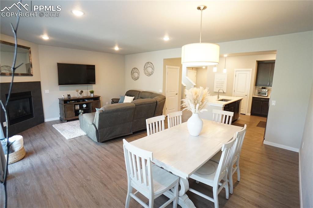 5309 Passport View Colorado Springs, CO 80922 - Photo 8 of 33 a view of a dining room with furniture window and wooden floor