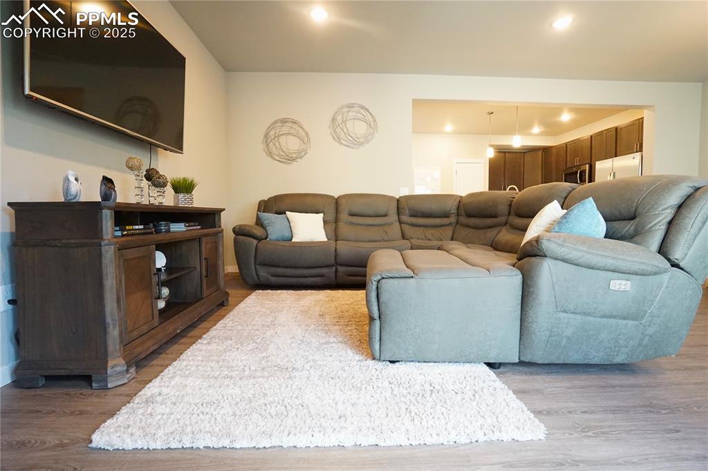 5309 Passport View Colorado Springs, CO 80922 - Photo 10 of 33 a living room with furniture and a flat screen tv