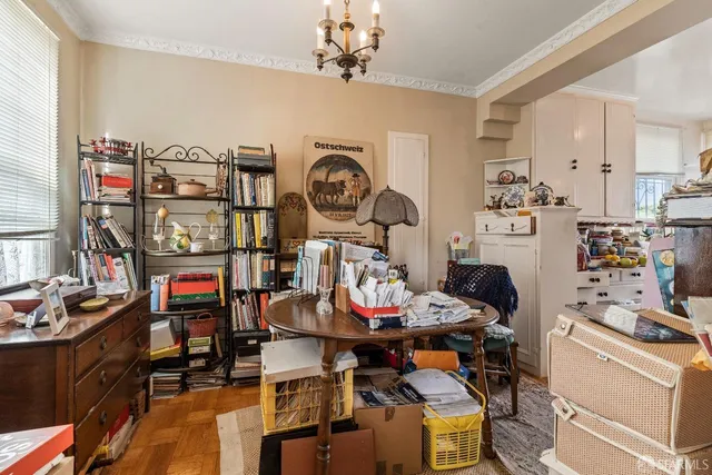 a view of a dining room with furniture and toys