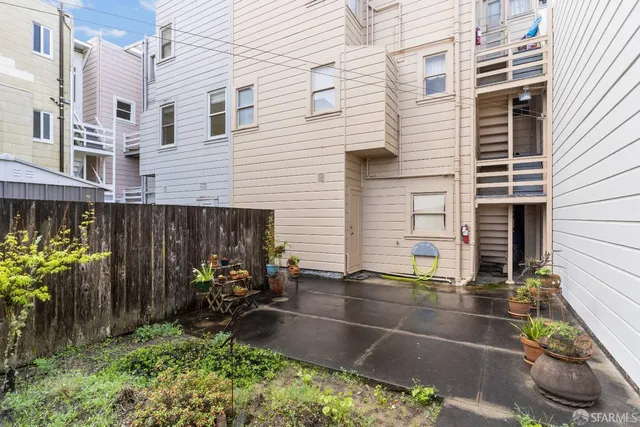 a view of a backyard with sitting area and furniture