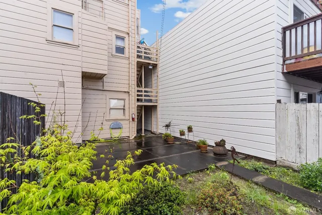 a view of a backyard with sitting area