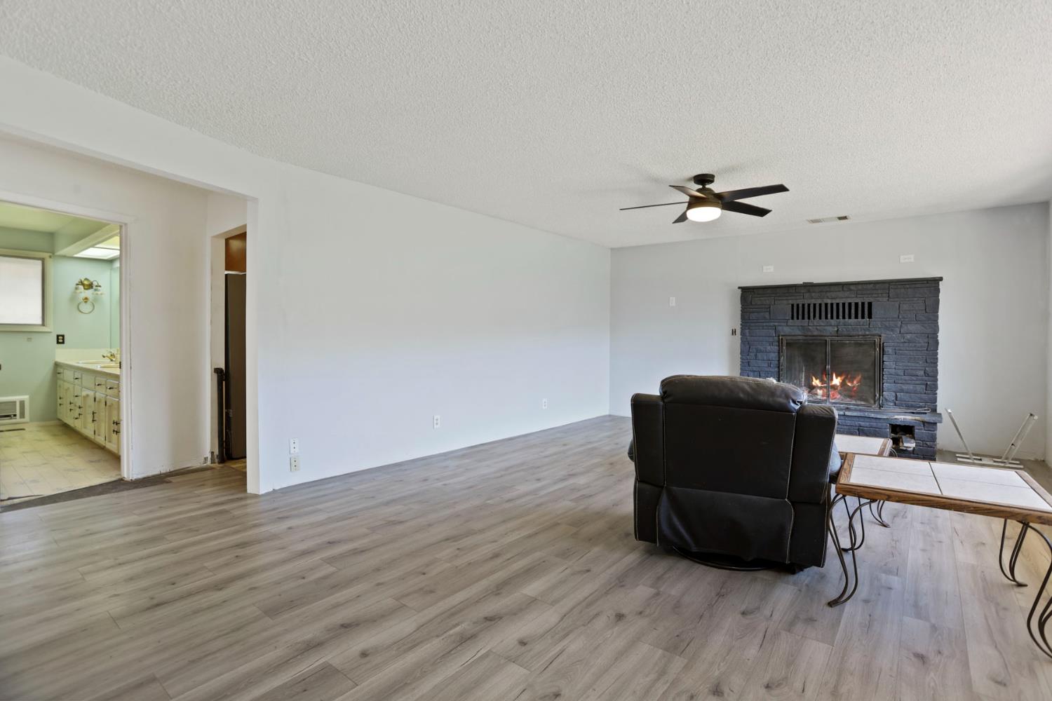 20200 Tuolumne Road North Tuolumne, CA 95379 - Photo 18 of 43 a living room with furniture and a wooden floor