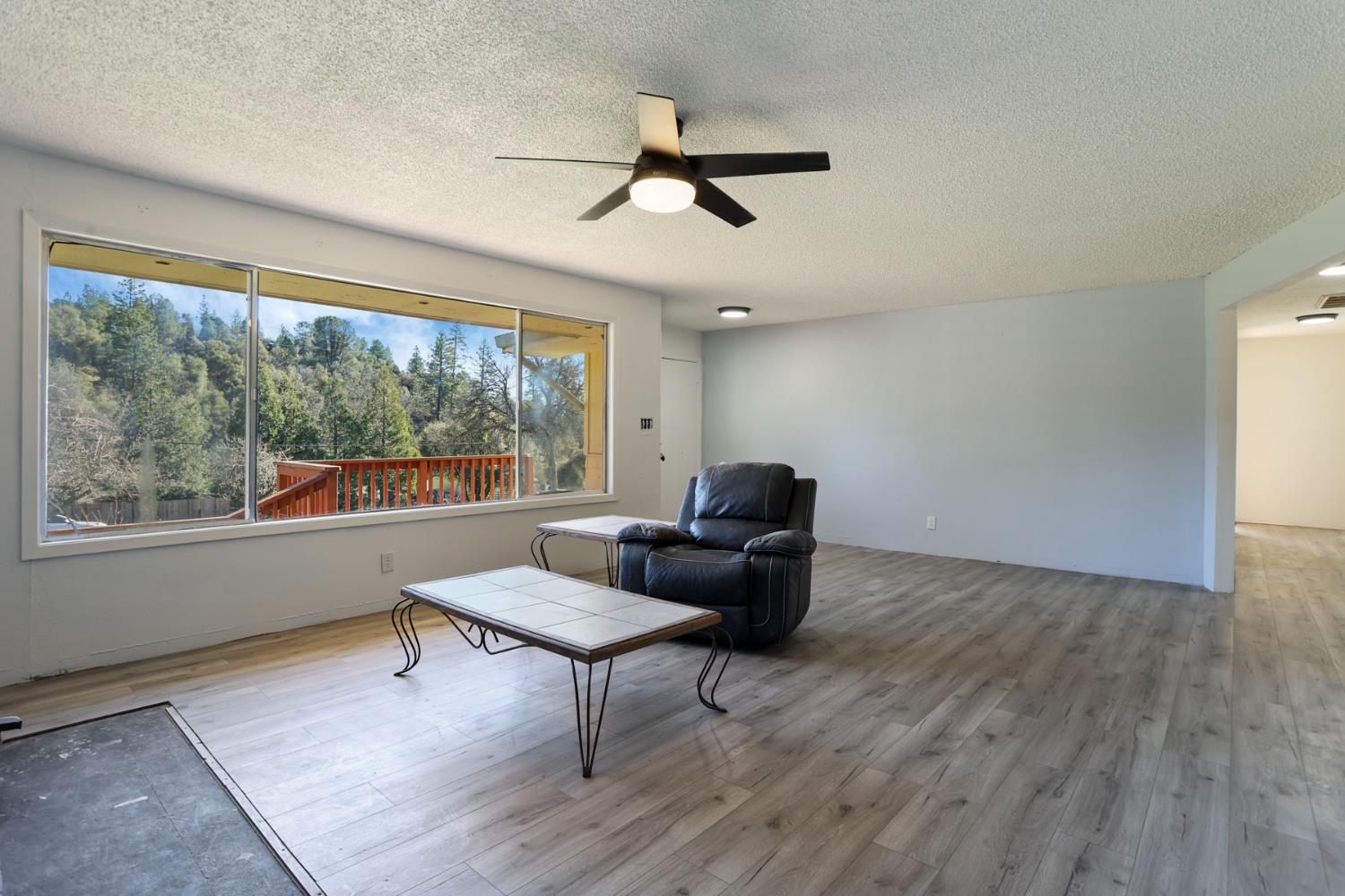 20200 Tuolumne Road North Tuolumne, CA 95379 - Photo 19 of 43 a living room with furniture and a window