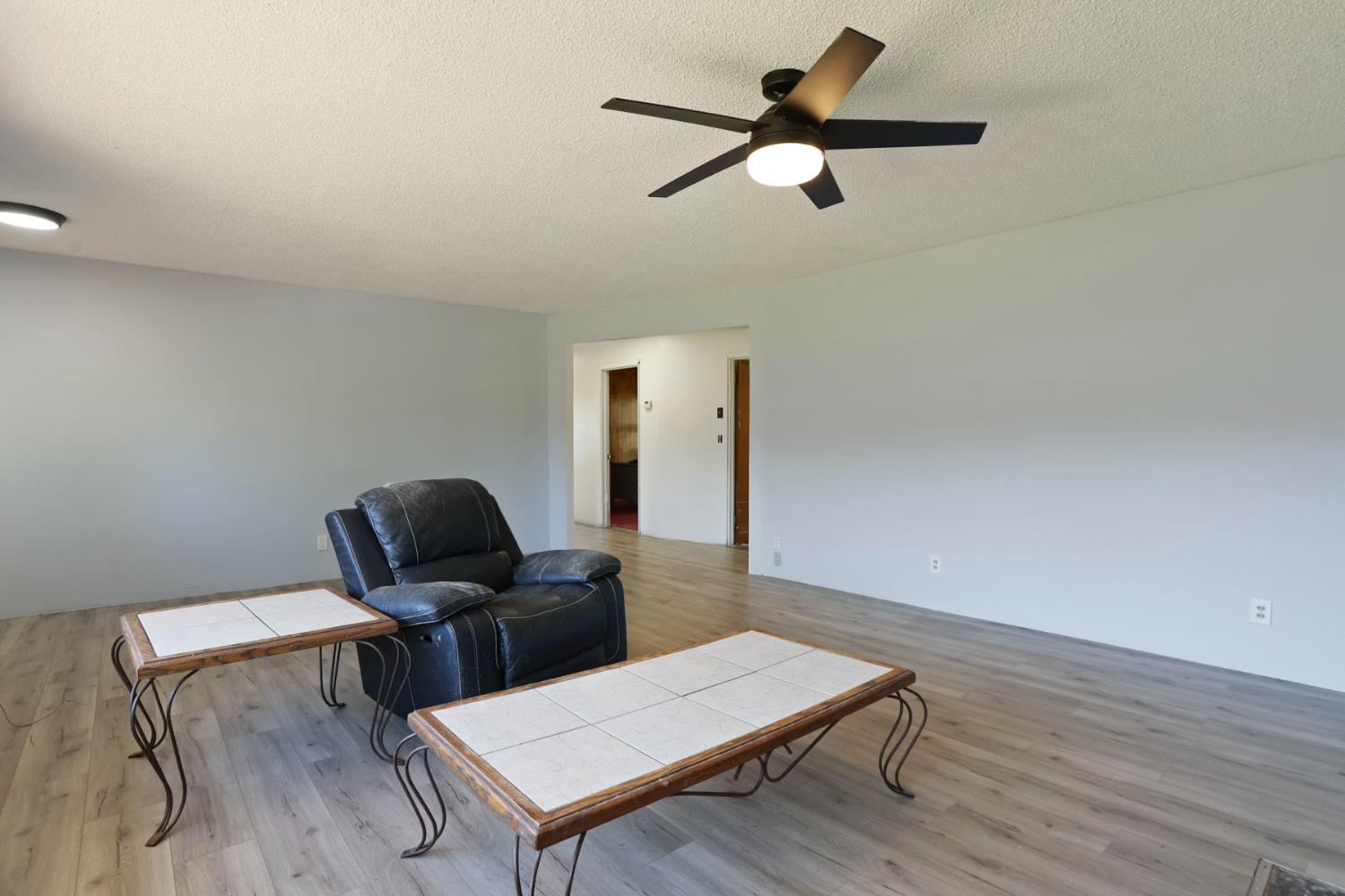 20200 Tuolumne Road North Tuolumne, CA 95379 - Photo 20 of 43 a view of workspace with wooden floor lounge chair and windows