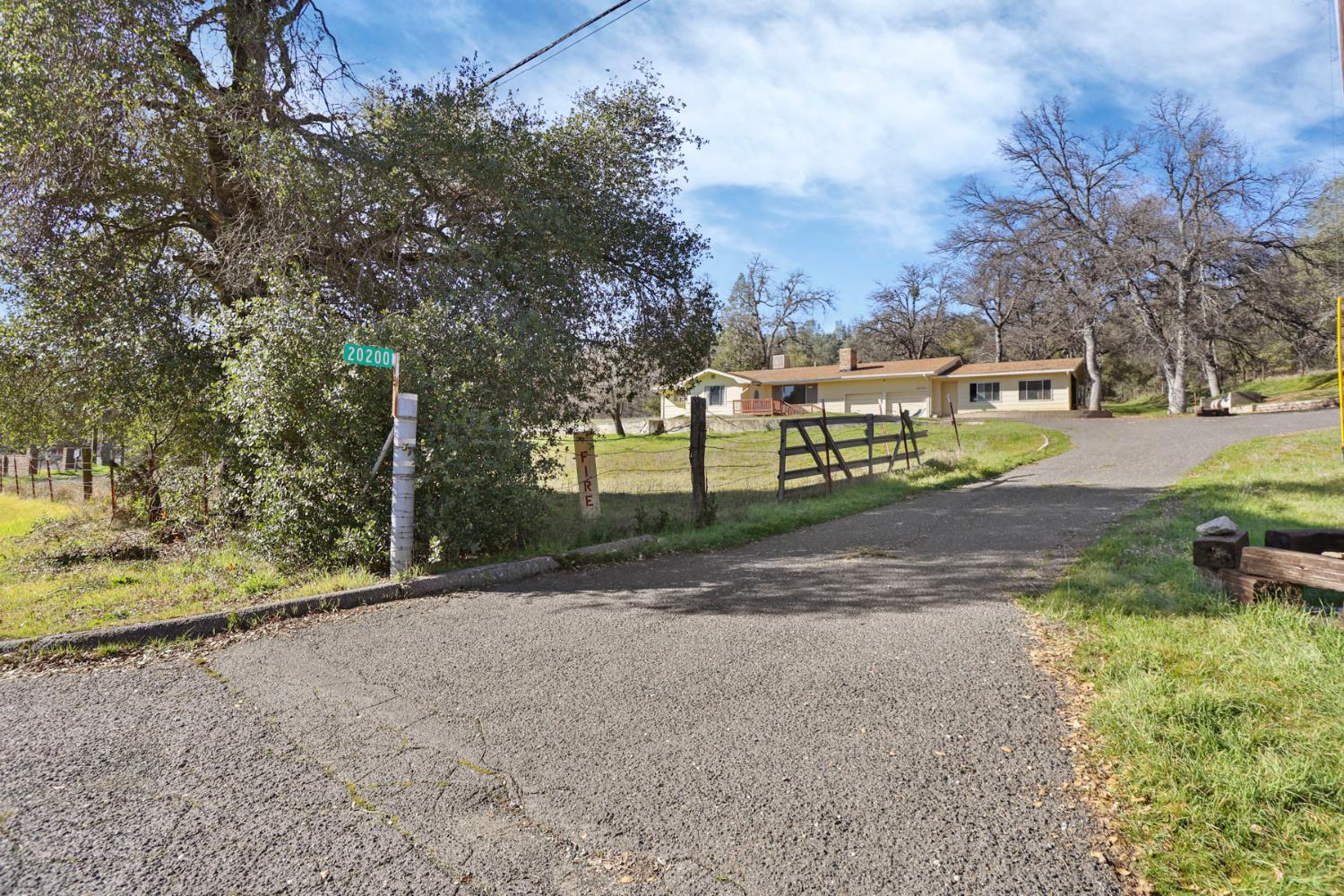 20200 Tuolumne Road North Tuolumne, CA 95379 - Photo 3 of 43 a view of street with large trees