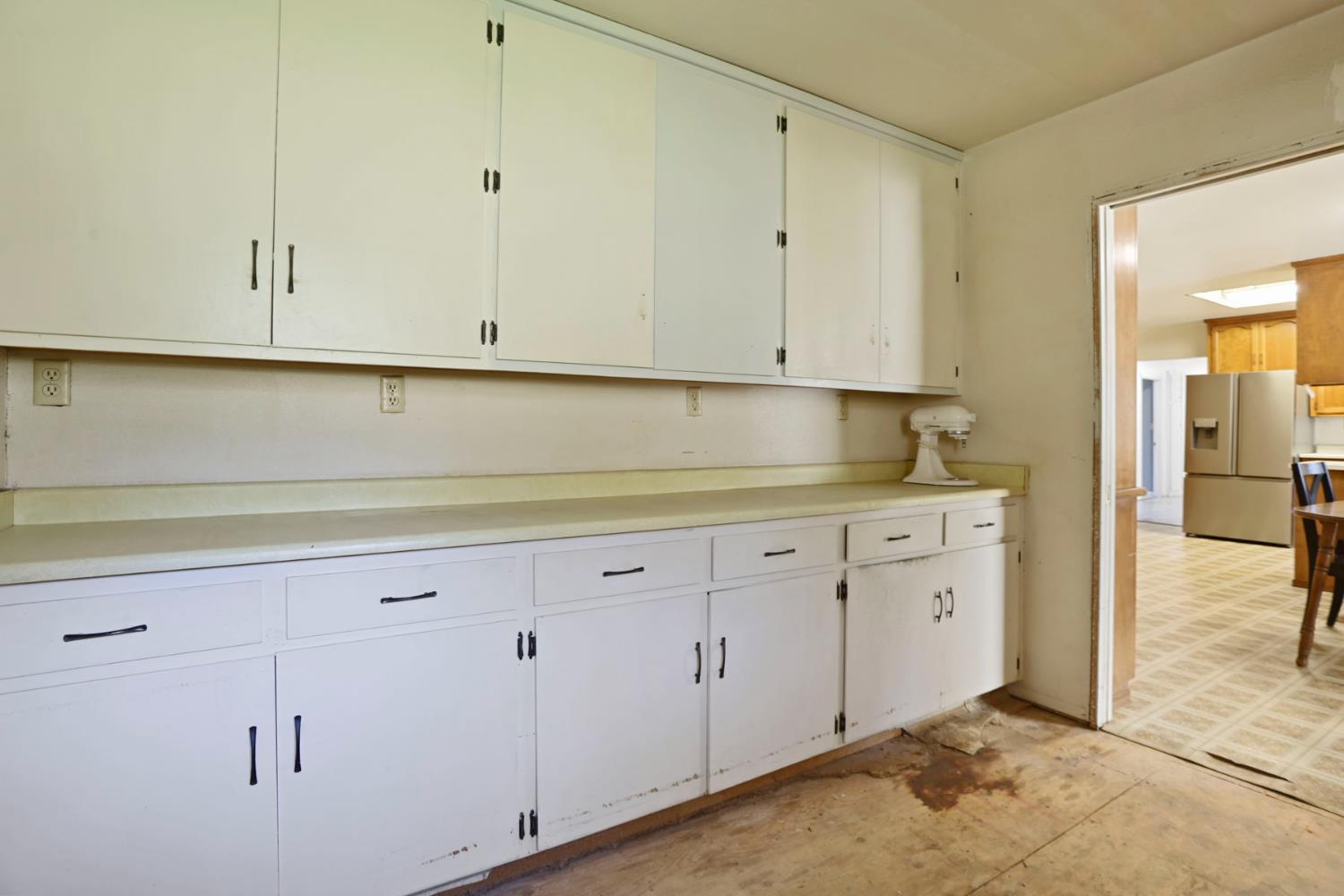 20200 Tuolumne Road North Tuolumne, CA 95379 - Photo 41 of 43 a kitchen with white cabinets and a sink