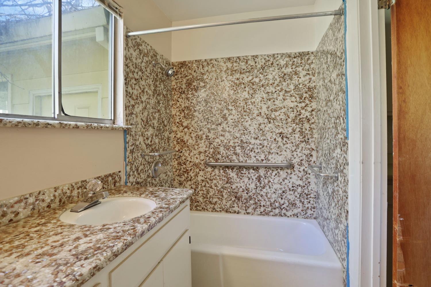20200 Tuolumne Road North Tuolumne, CA 95379 - Photo 43 of 43 a bathroom with a granite countertop sink toilet and shower