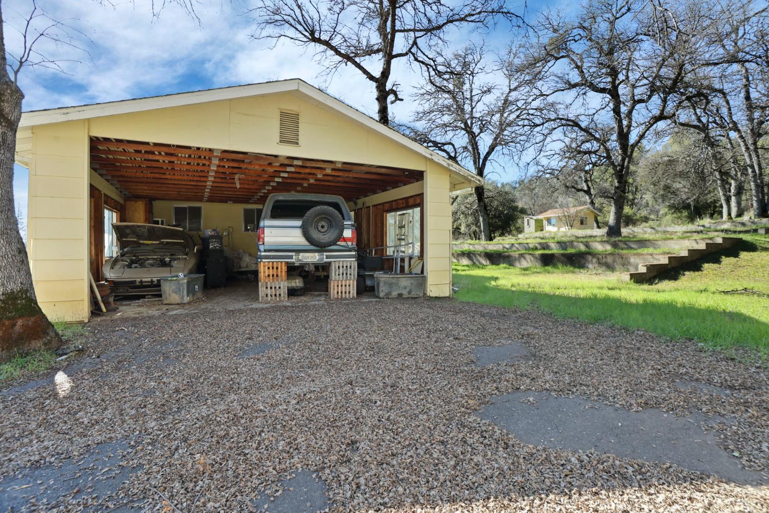 20200 Tuolumne Road North Tuolumne, CA 95379 - Photo 6 of 43 a front view of a house with a yard