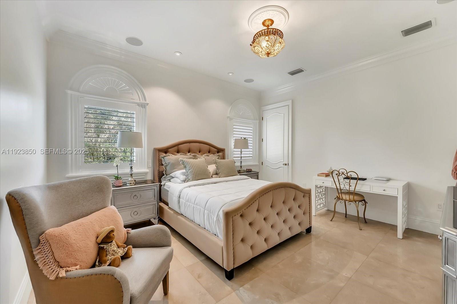 18611 Southwest 122nd Street Miami, FL 33196 - Photo 12 of 55 a bedroom with a bed chairs and window