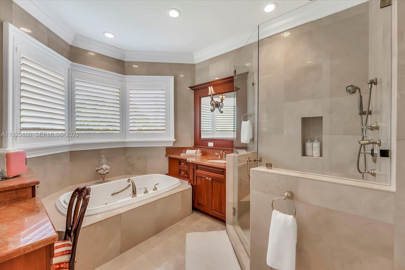 18611 Southwest 122nd Street Miami, FL 33196 - Photo 13 of 55 a bathroom with a tub sink and mirror