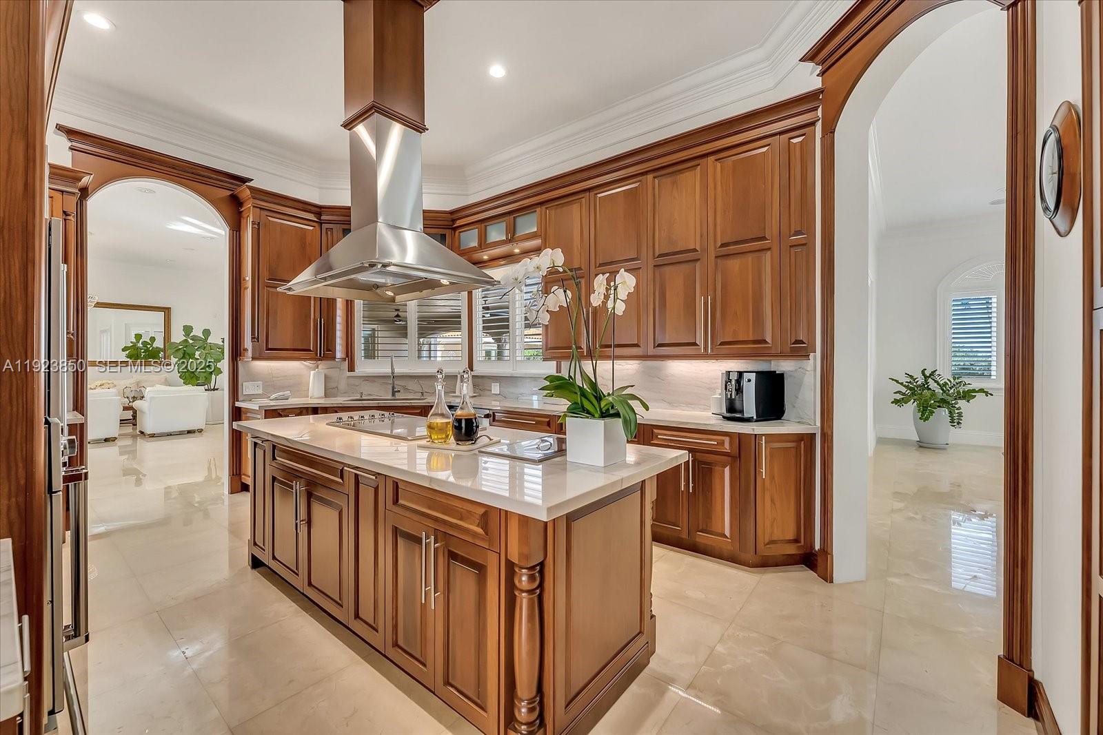 18611 Southwest 122nd Street Miami, FL 33196 - Photo 20 of 55 a kitchen with kitchen island a stove a sink and a refrigerator