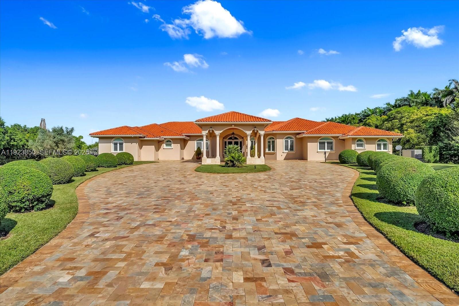 18611 Southwest 122nd Street Miami, FL 33196 - Photo 2 of 55 a front view of a house with a yard