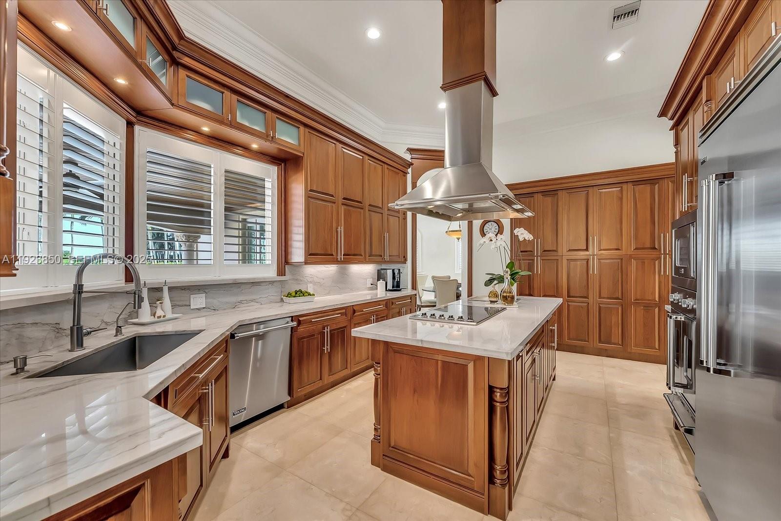 18611 Southwest 122nd Street Miami, FL 33196 - Photo 21 of 55 a kitchen with stainless steel appliances granite countertop a sink stove and refrigerator