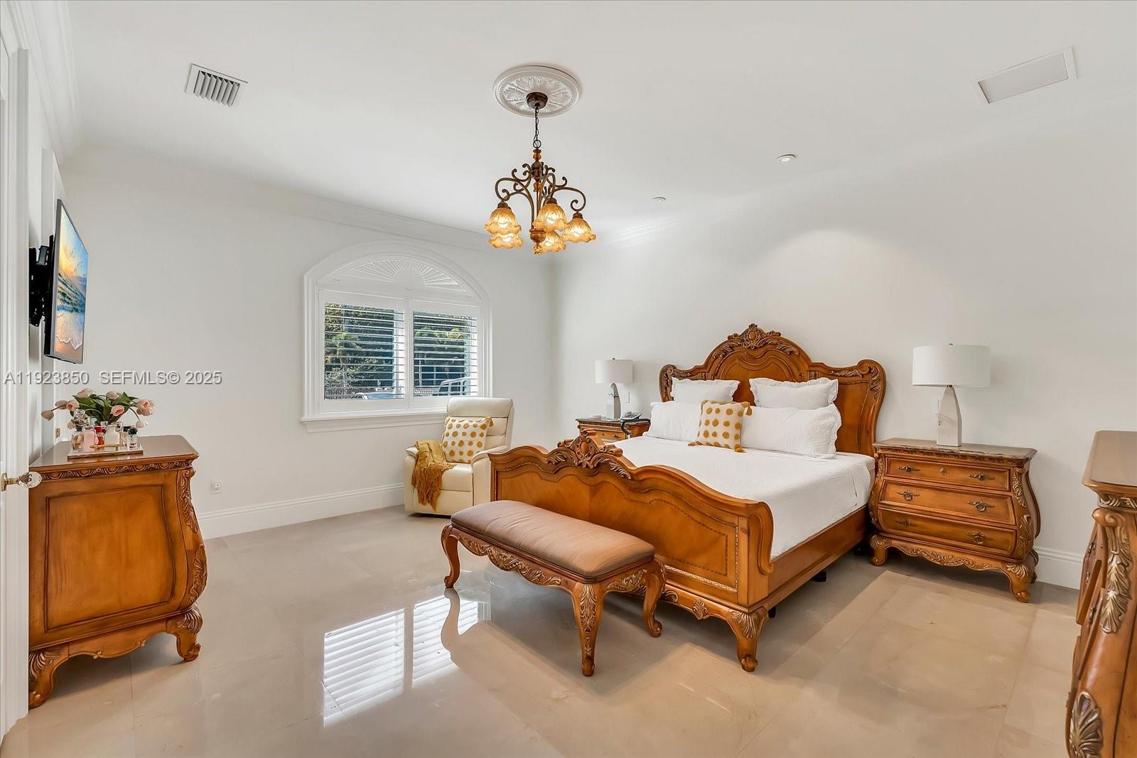 18611 Southwest 122nd Street Miami, FL 33196 - Photo 26 of 55 a bedroom with a bed and a dresser in it