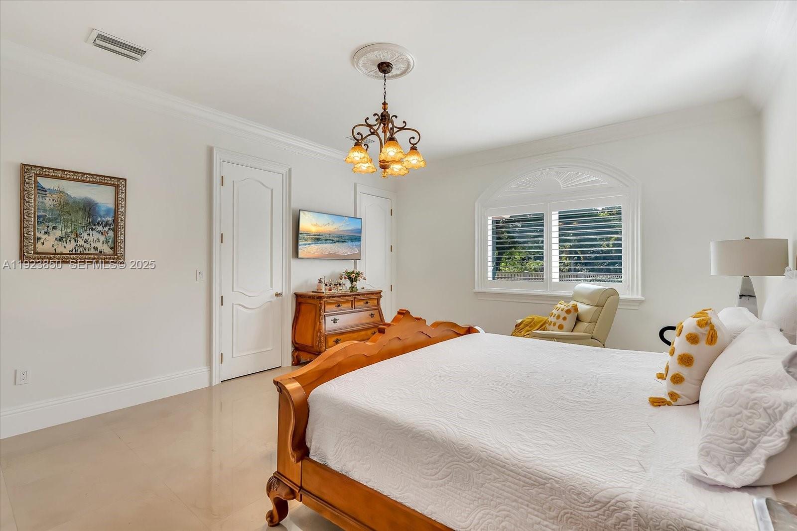 18611 Southwest 122nd Street Miami, FL 33196 - Photo 27 of 55 a bedroom with bed and window