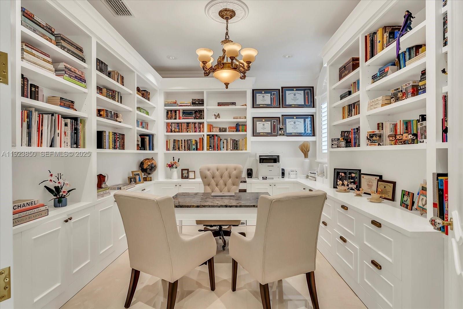 18611 Southwest 122nd Street Miami, FL 33196 - Photo 30 of 55 a dining room with furniture a bookshelf and a window