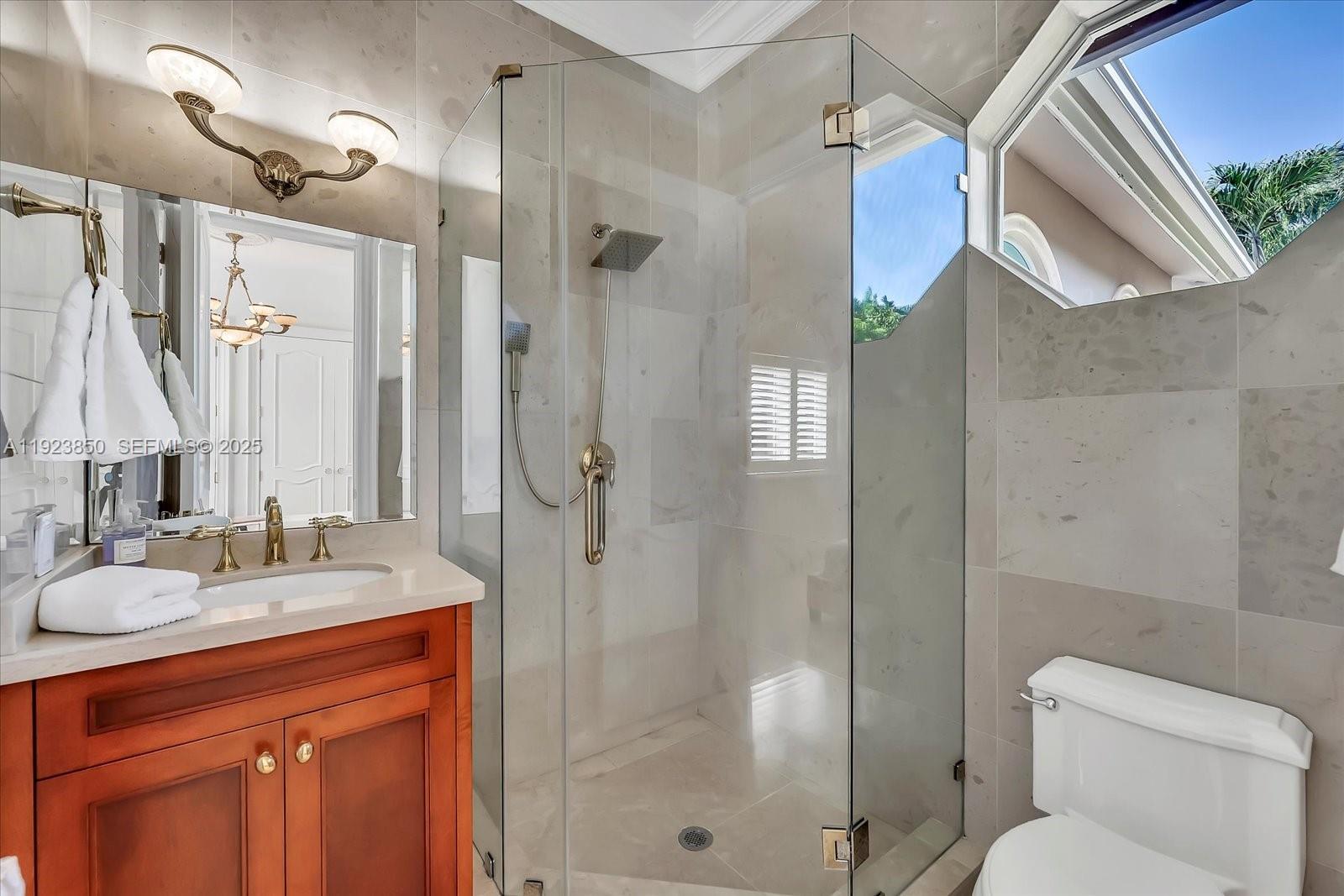 18611 Southwest 122nd Street Miami, FL 33196 - Photo 33 of 55 a bathroom with a granite countertop sink toilet and shower