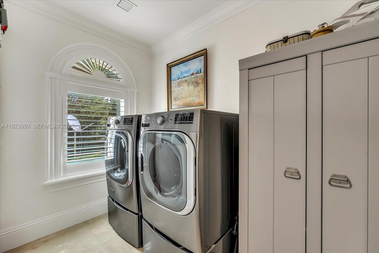 18611 Southwest 122nd Street Miami, FL 33196 - Photo 34 of 55 a utility room with dryer and washer