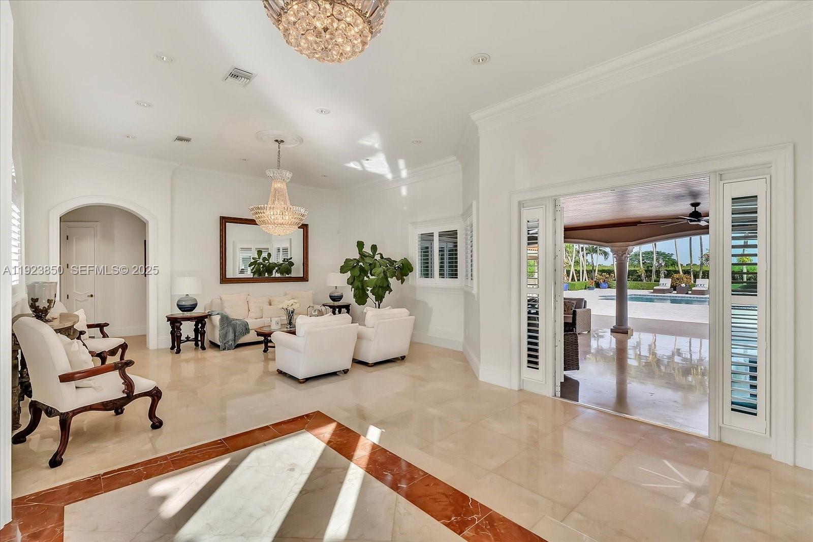 18611 Southwest 122nd Street Miami, FL 33196 - Photo 35 of 55 a living room with furniture and a floor to ceiling window