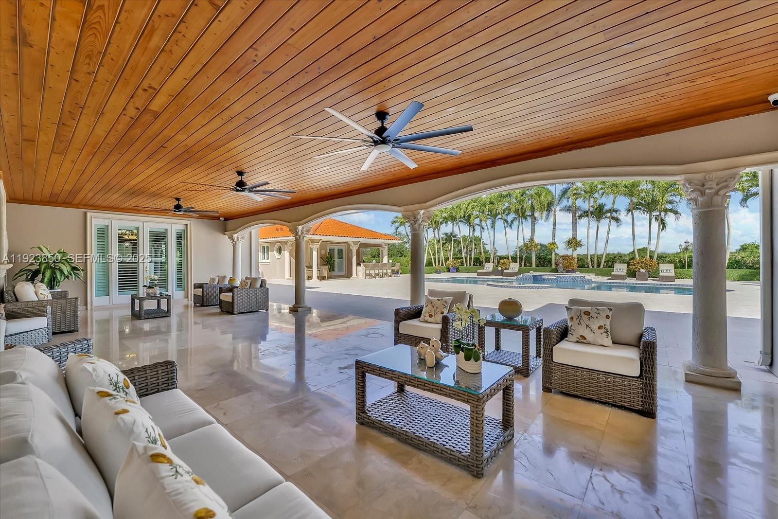 18611 Southwest 122nd Street Miami, FL 33196 - Photo 36 of 55 a living room with furniture and a large window