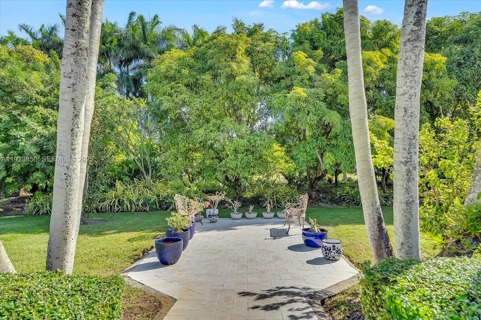 18611 Southwest 122nd Street Miami, FL 33196 - Photo 42 of 55 a view of a garden with patio