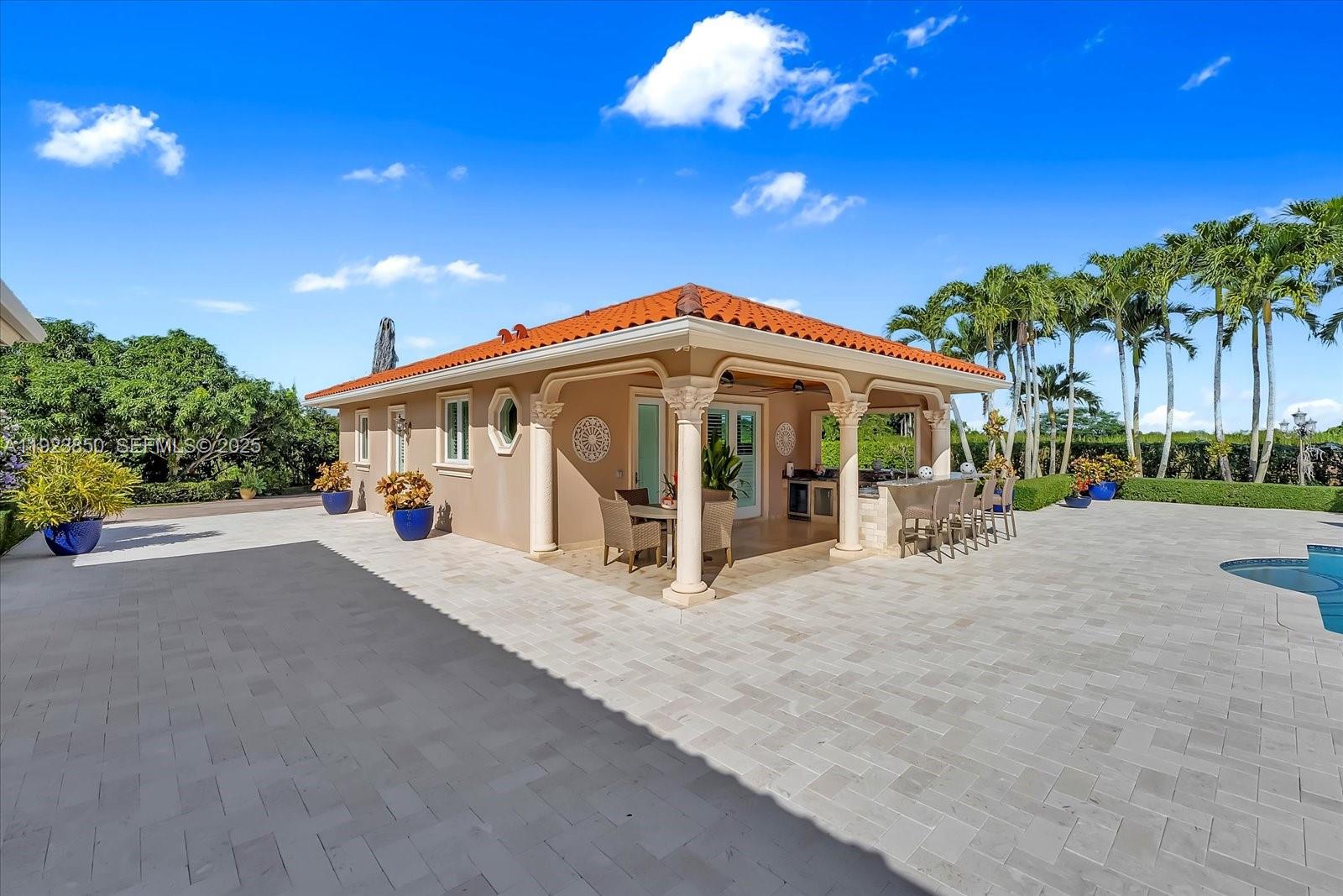 18611 Southwest 122nd Street Miami, FL 33196 - Photo 45 of 55 a view of a house with patio and a yard