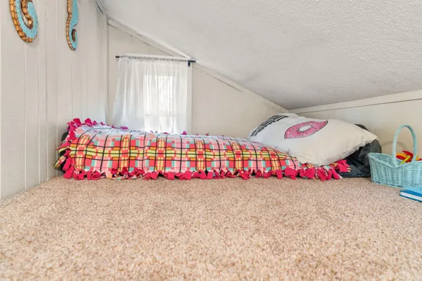 a view of balcony with furniture and wooden floor