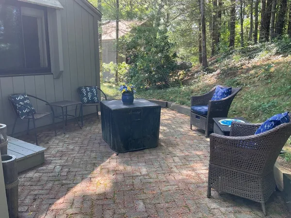 a view of a house with a backyard