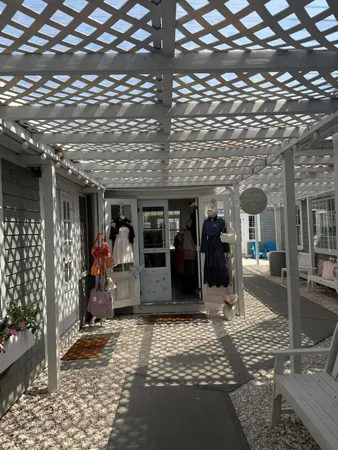 an aerial view of house with yard and mountain view in back