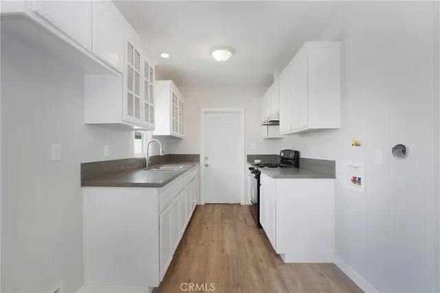 a bathroom with a white toilet and a shower