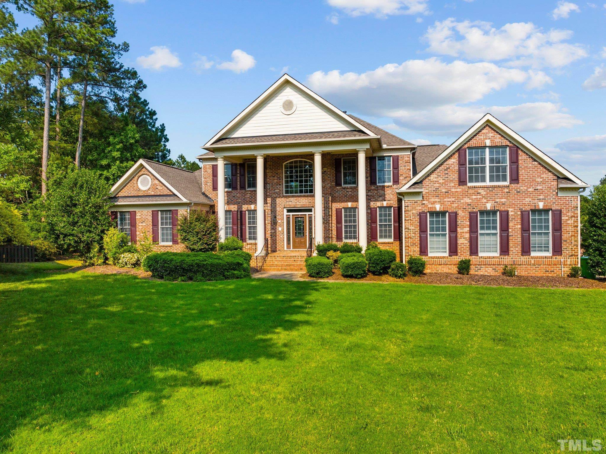 9501 Bluemont Court Raleigh, NC 27617 - Photo 1 of 85 a front view of a house with a yard