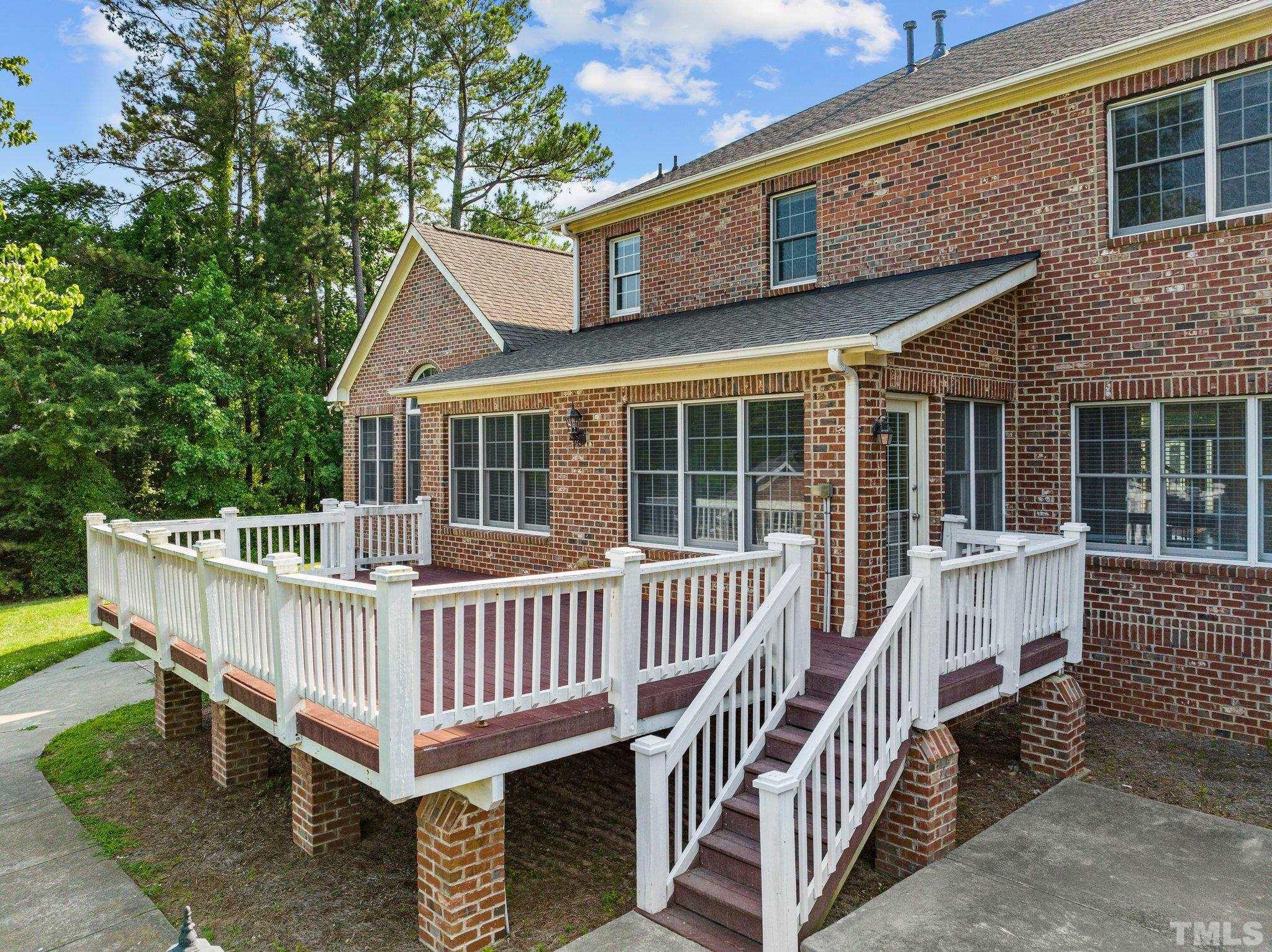 9501 Bluemont Court Raleigh, NC 27617 - Photo 12 of 85 a view of a deck with a table and chair
