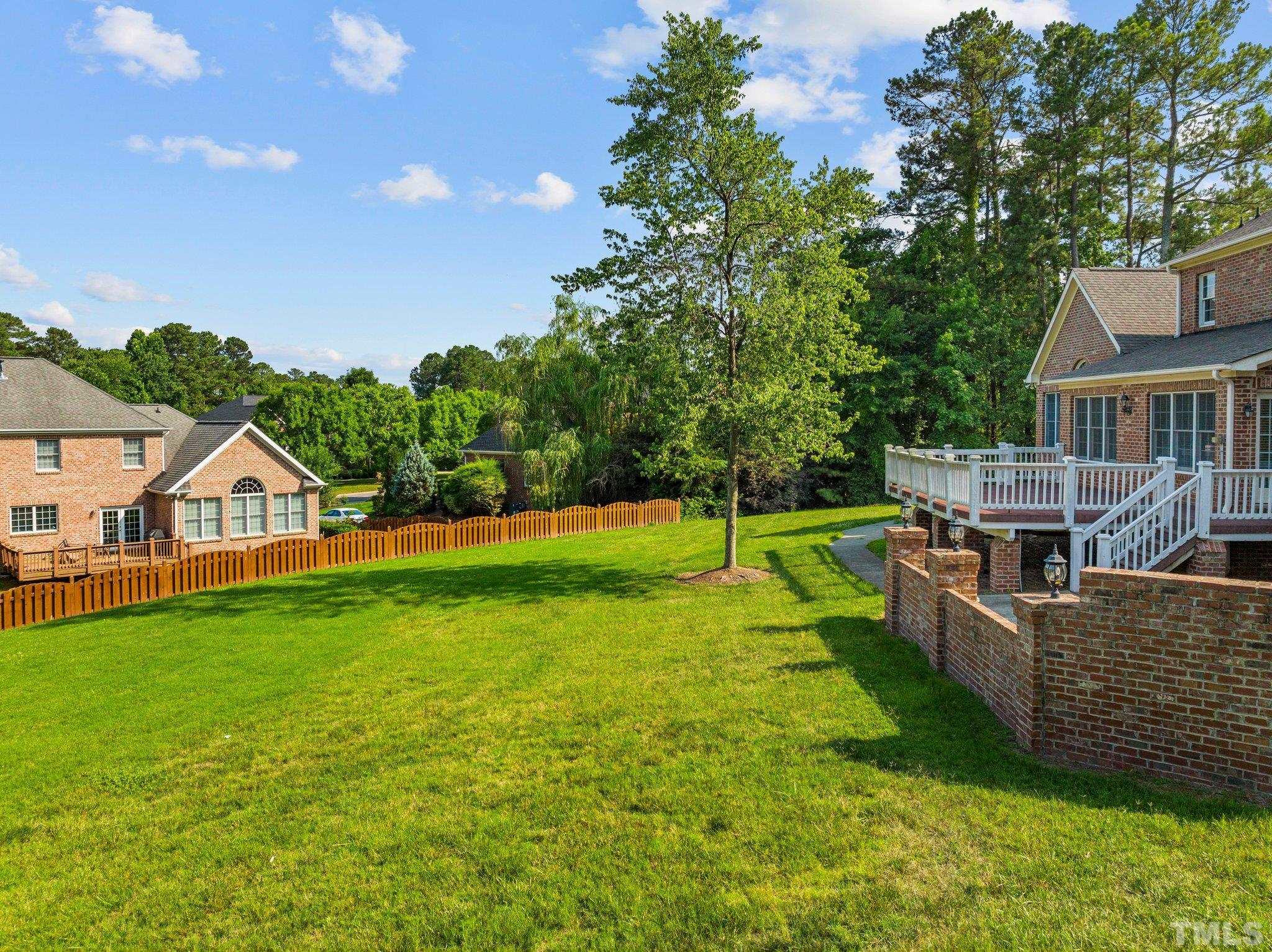 9501 Bluemont Court Raleigh, NC 27617 - Photo 15 of 85 a view of a house with a yard porch and sitting area