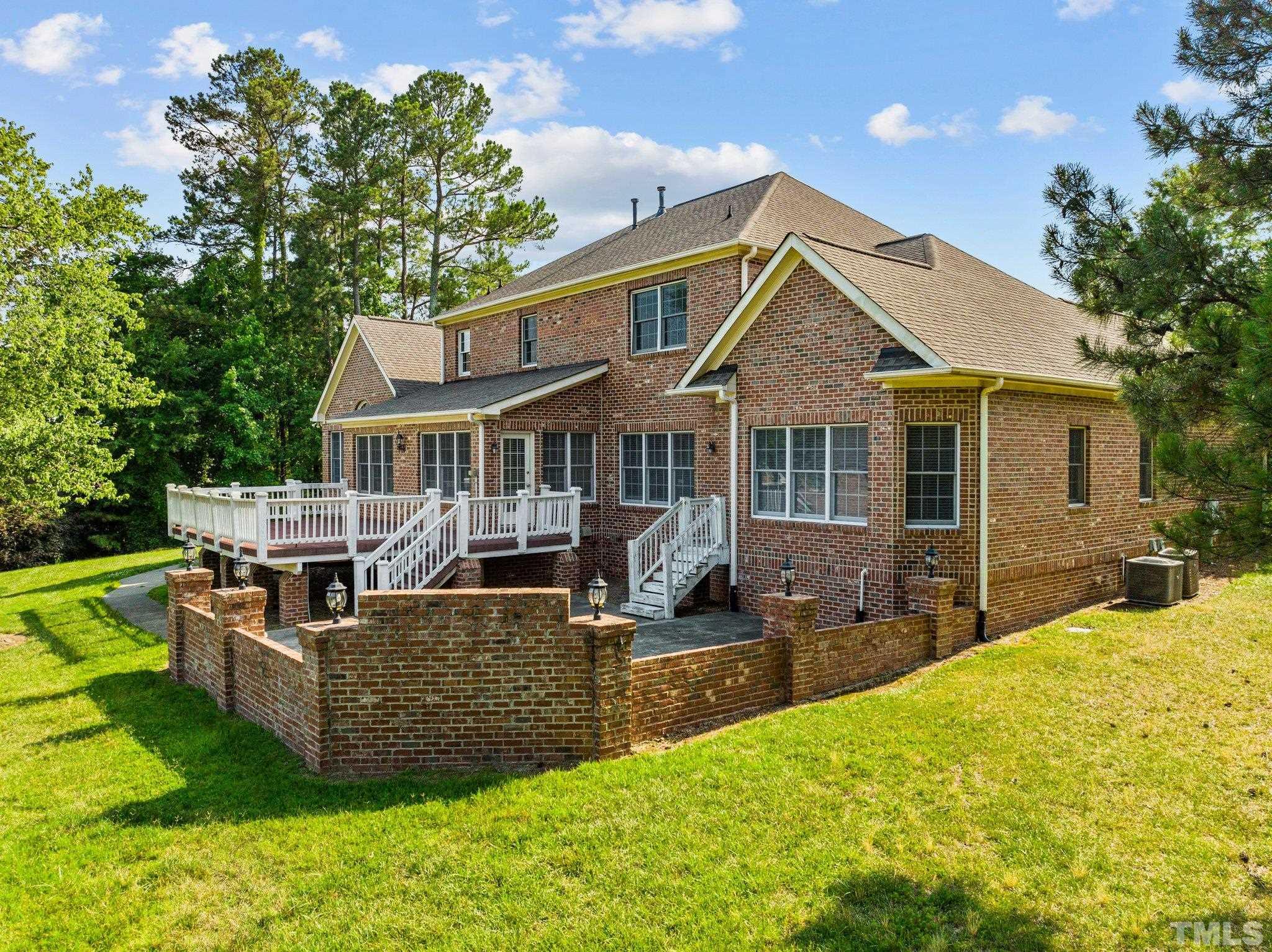 9501 Bluemont Court Raleigh, NC 27617 - Photo 16 of 85 a view of a house with a big yard and sitting area