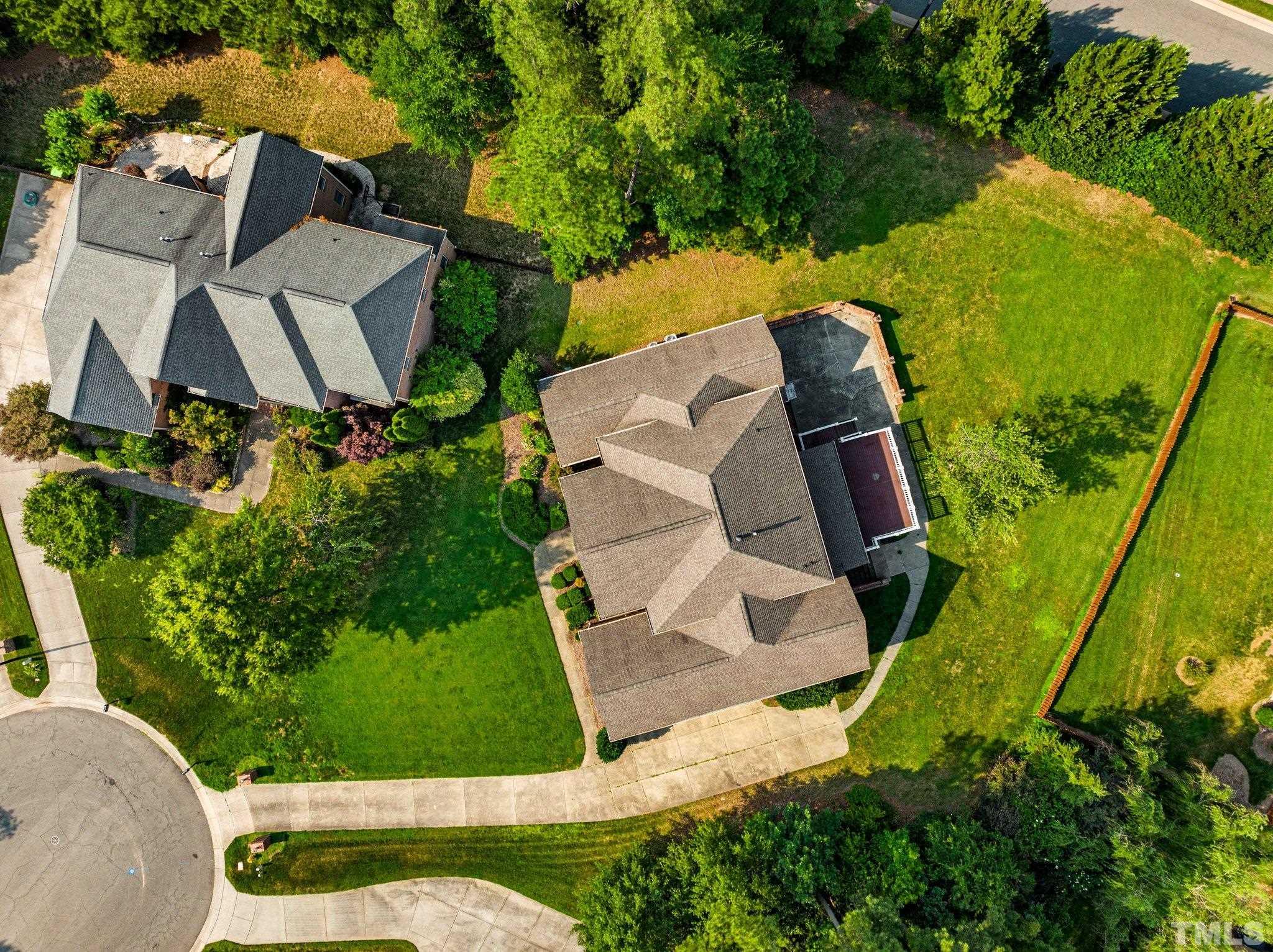 9501 Bluemont Court Raleigh, NC 27617 - Photo 21 of 85 an aerial view of a house with garden space and street view