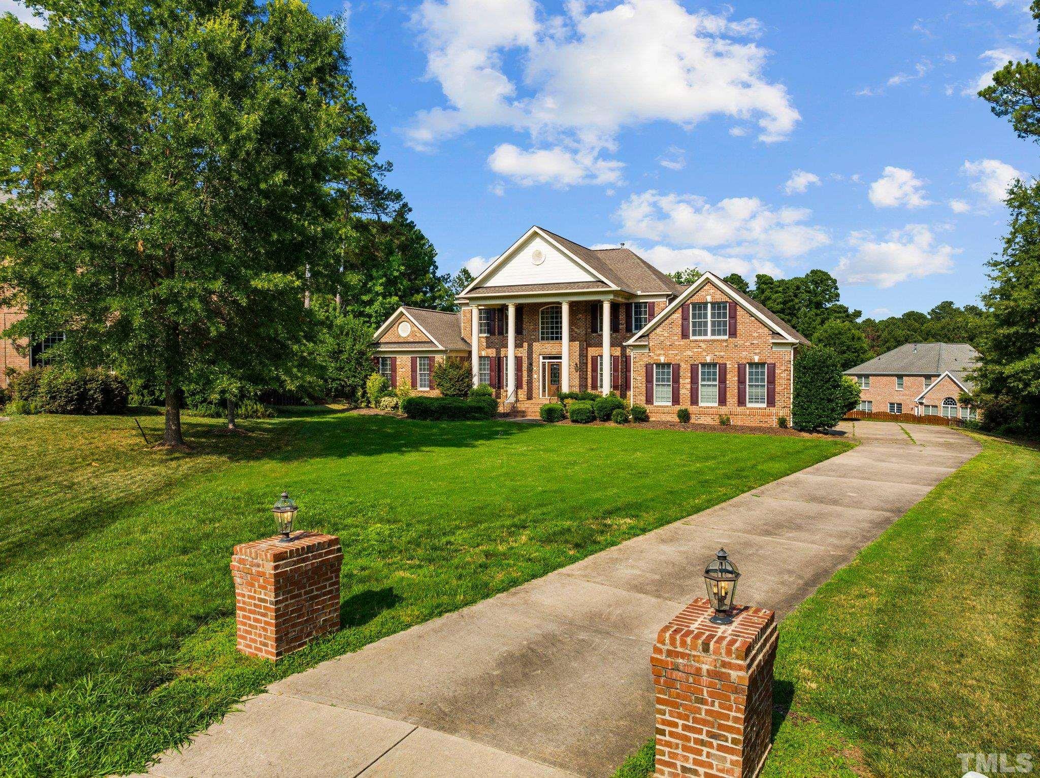 9501 Bluemont Court Raleigh, NC 27617 - Photo 26 of 85 a front view of a house with garden