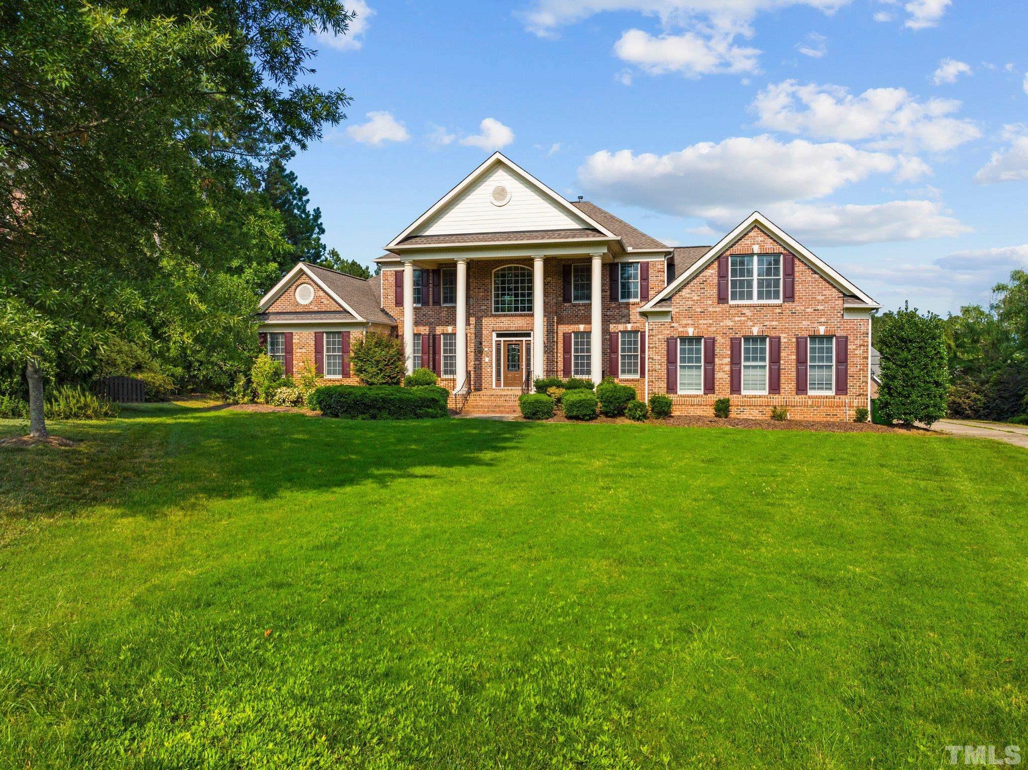 9501 Bluemont Court Raleigh, NC 27617 - Photo 3 of 85 a front view of a house with a yard