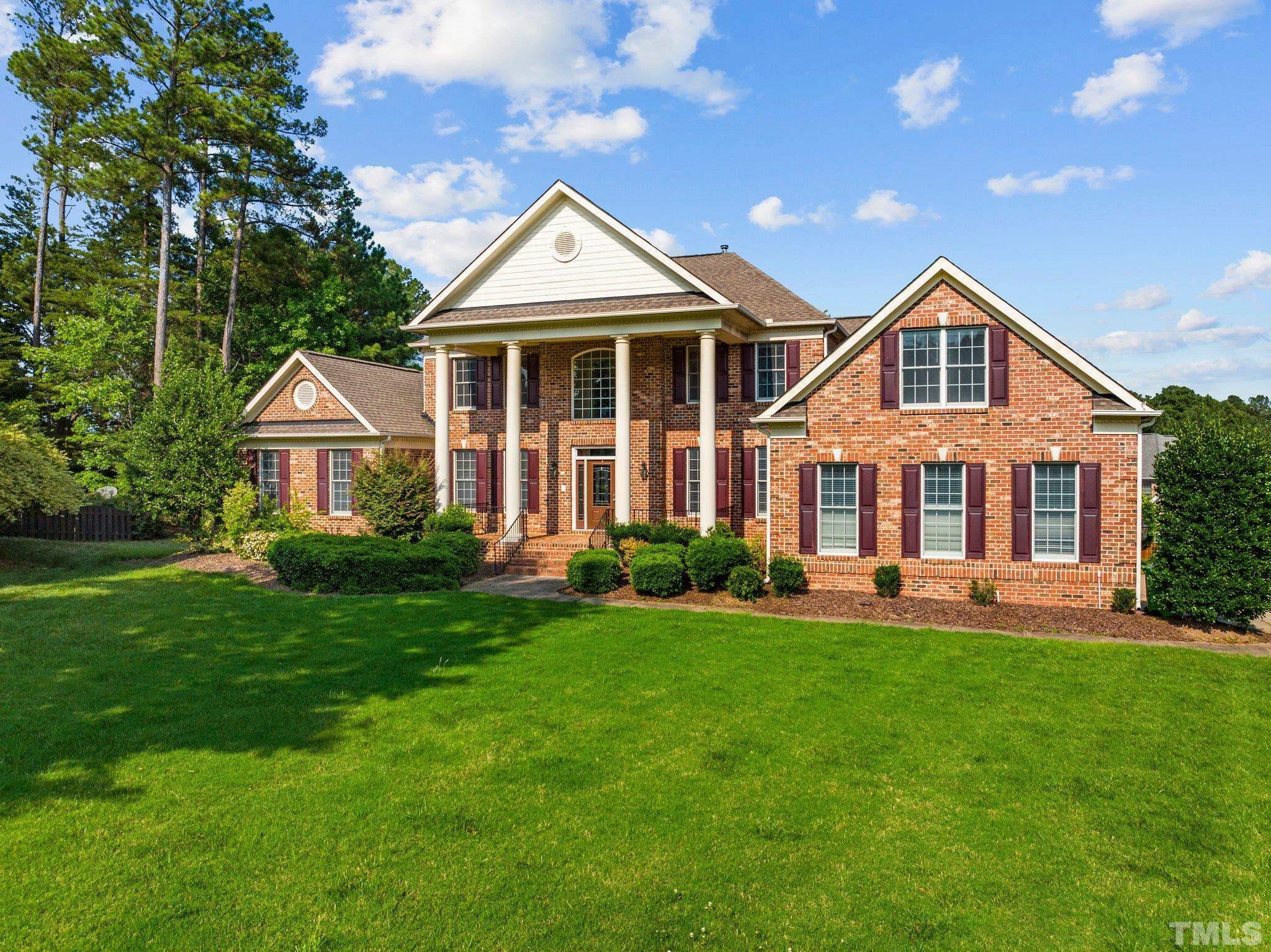 9501 Bluemont Court Raleigh, NC 27617 - Photo 4 of 85 a front view of a house with a yard