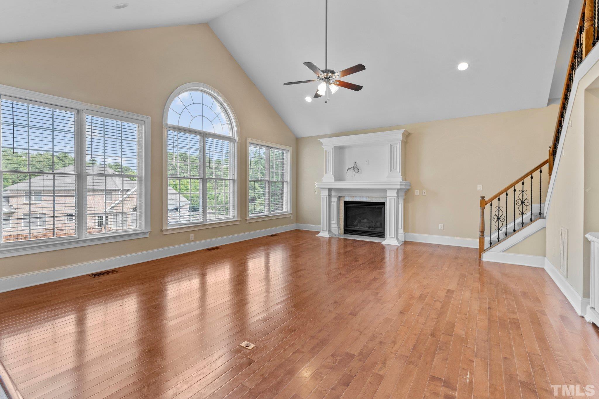 9501 Bluemont Court Raleigh, NC 27617 - Photo 49 of 85 a view of an empty room with wooden floor and a window
