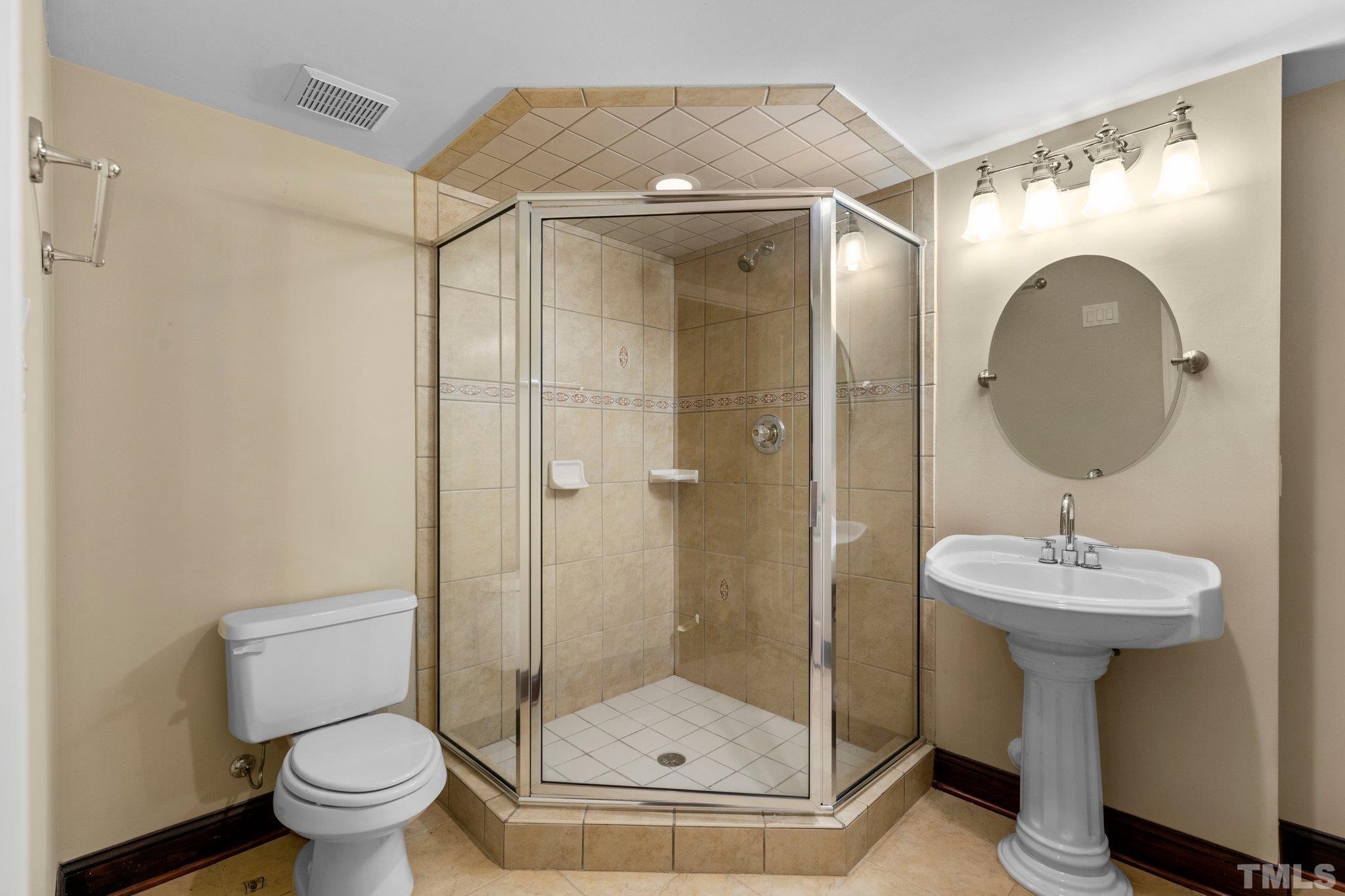 9501 Bluemont Court Raleigh, NC 27617 - Photo 68 of 85 a bathroom with a sink toilet and shower