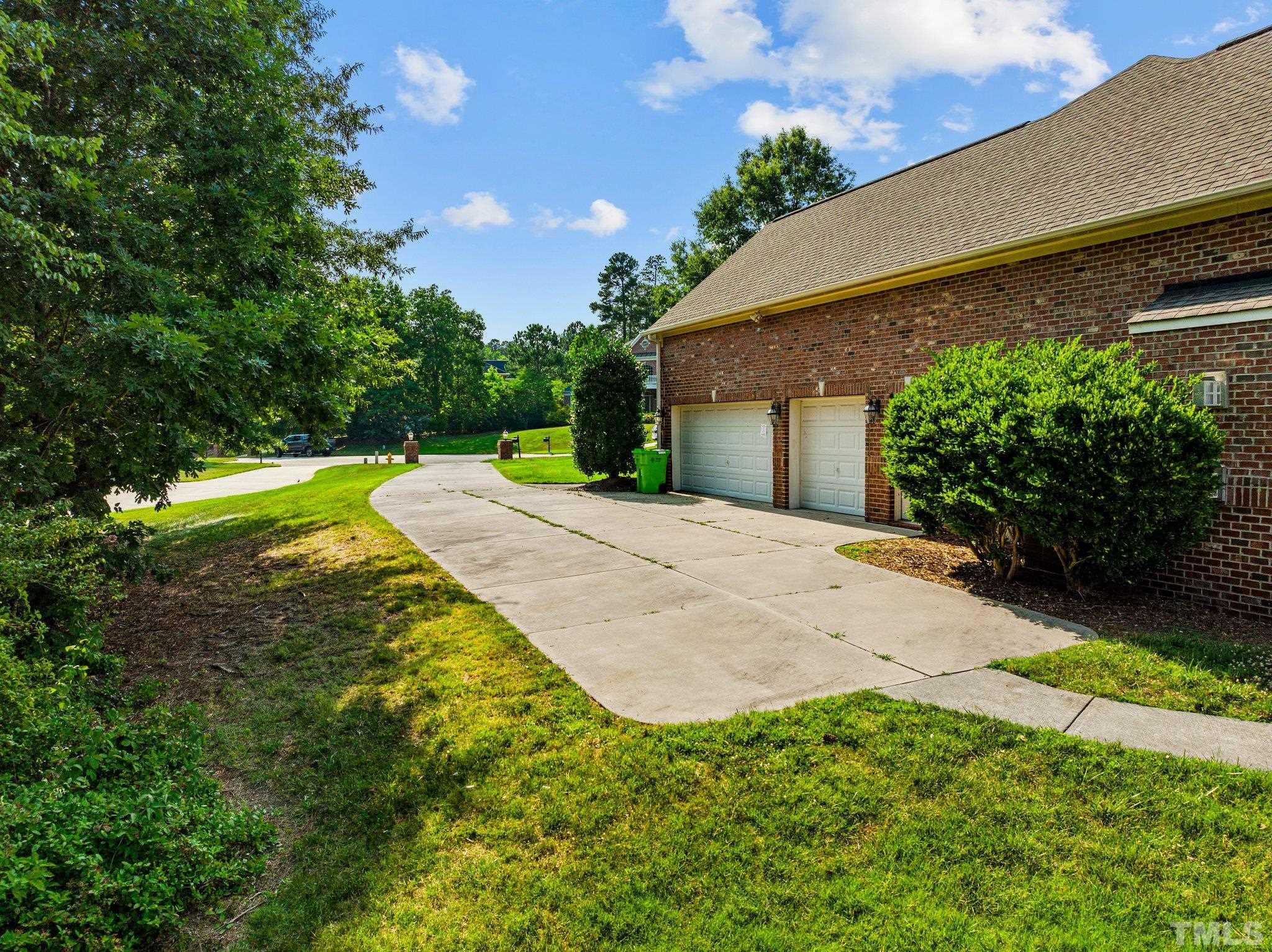 9501 Bluemont Court Raleigh, NC 27617 - Photo 8 of 85 a view of a backyard with a garden
