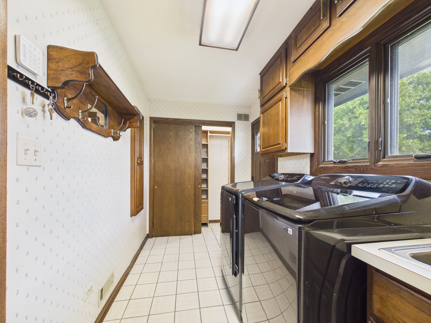 6723 Kingswood Road Willowbrook, IL 60527 - Photo 15 of 51 a kitchen with a stove a refrigerator a sink dishwasher and wooden cabinets