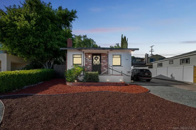 a front view of a house with garden