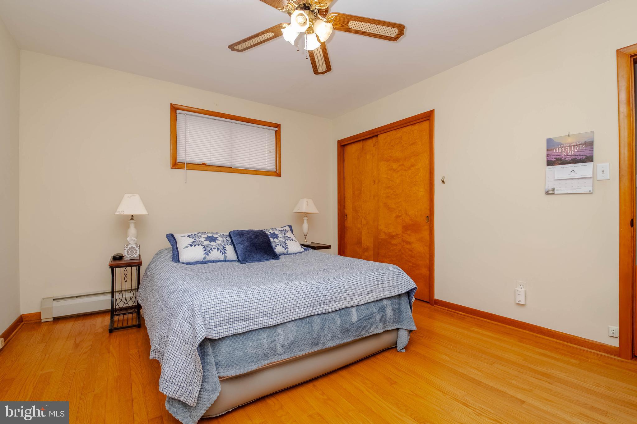 2319 Reckord Road Joppa, MD 21085 - Photo 17 of 45 a bedroom with a bed chandelier and a window