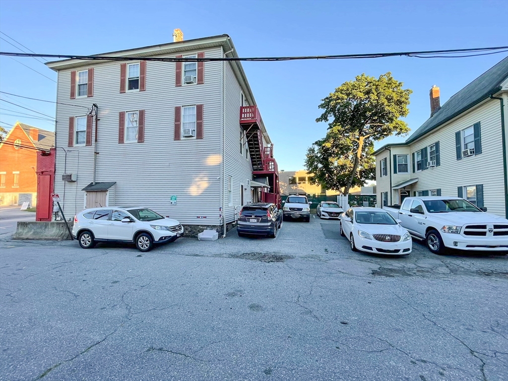 42 Mammoth Road Lowell, MA 01854 - Photo 14 of 15 a view of a cars parked in front of a house